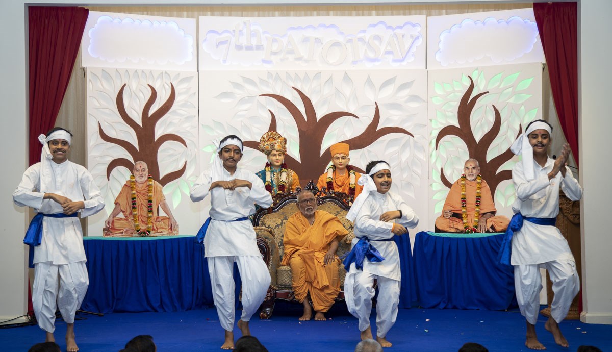 Children perform a traditional dance in the assembly
