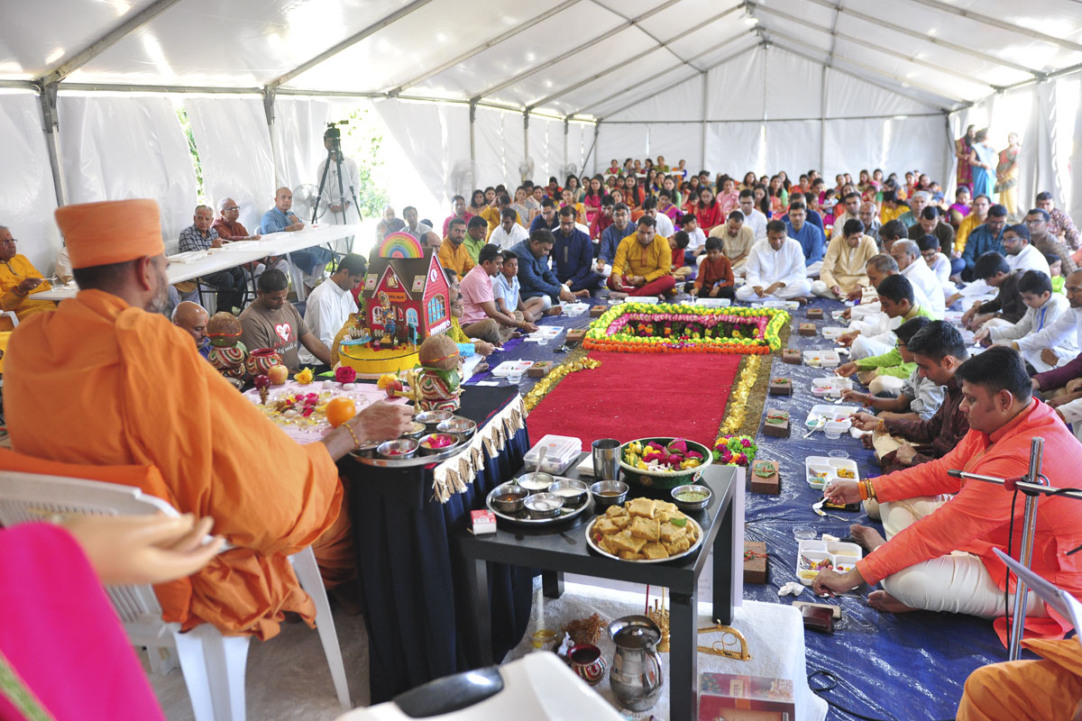 Sadhus and devotees participate in mahapuja rituals