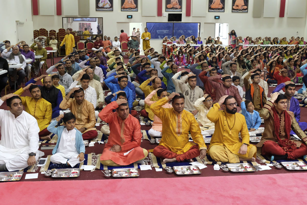 Devotees participate in patotsav mahapuja rituals