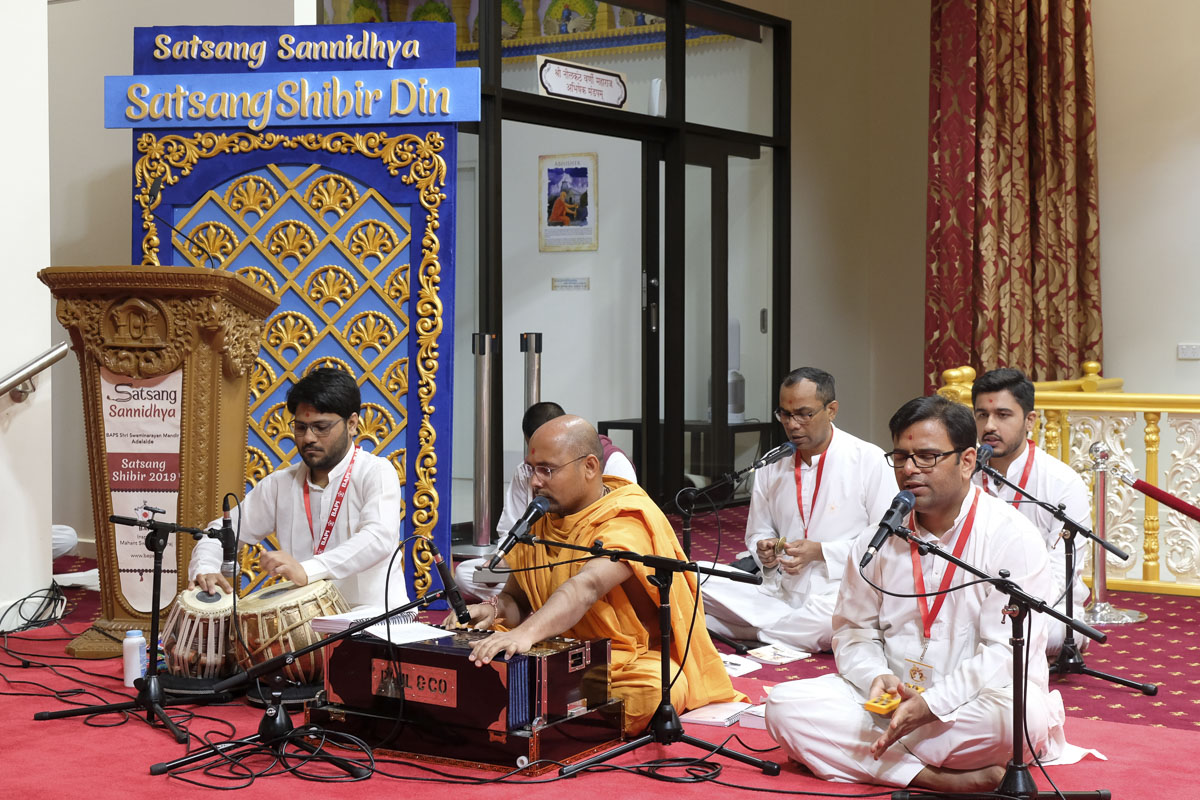Sadhus and youths sing kirtans in the satsang shibir 