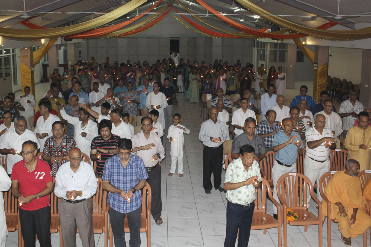 Devotees perform the arti