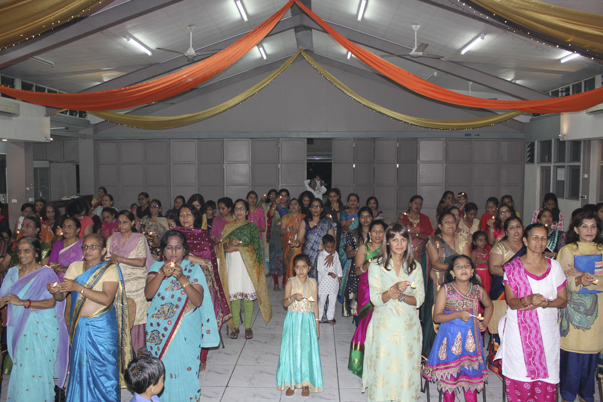 Devotees perform the arti