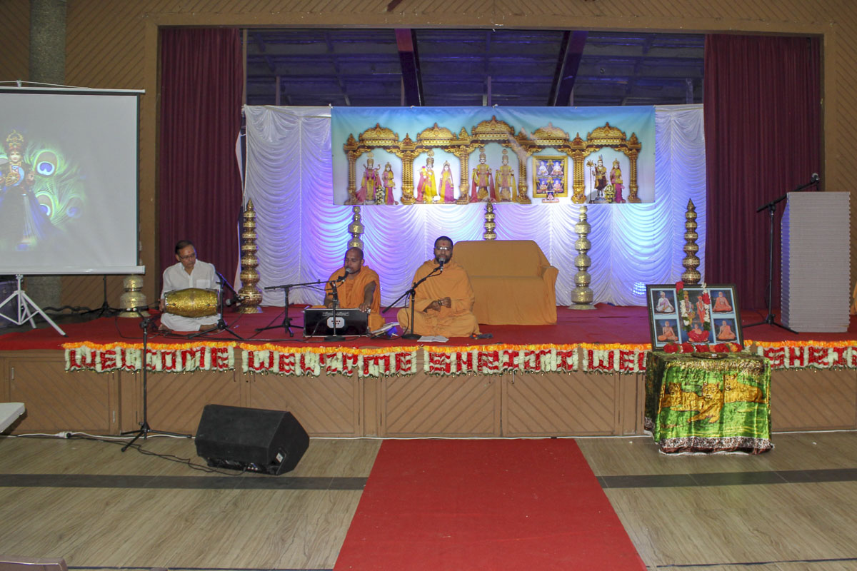 Sadhus sing kirtans in the assembly
