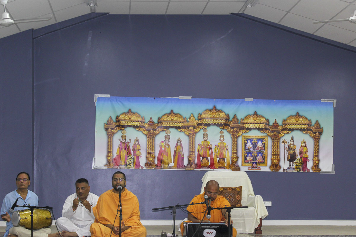 Sadhus sing kirtans in the assembly