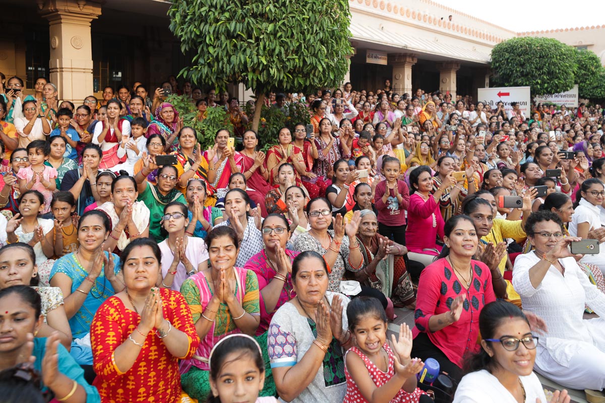 Devotees in the mandir grounds to welcome Swamishri