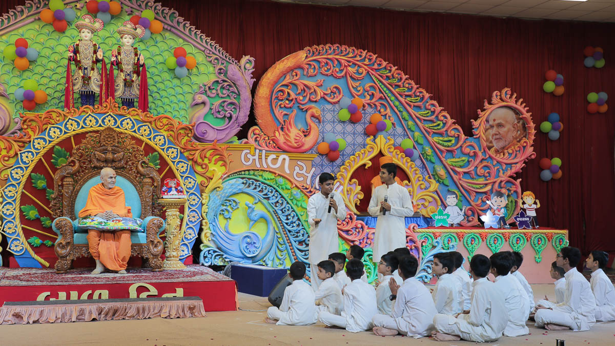 Children present a skit in the assembly