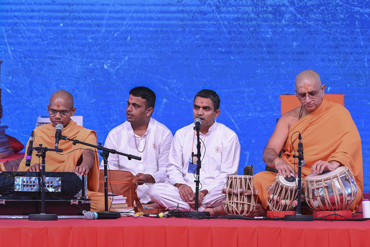 Sadhus and youths sing kirtans during the shibir