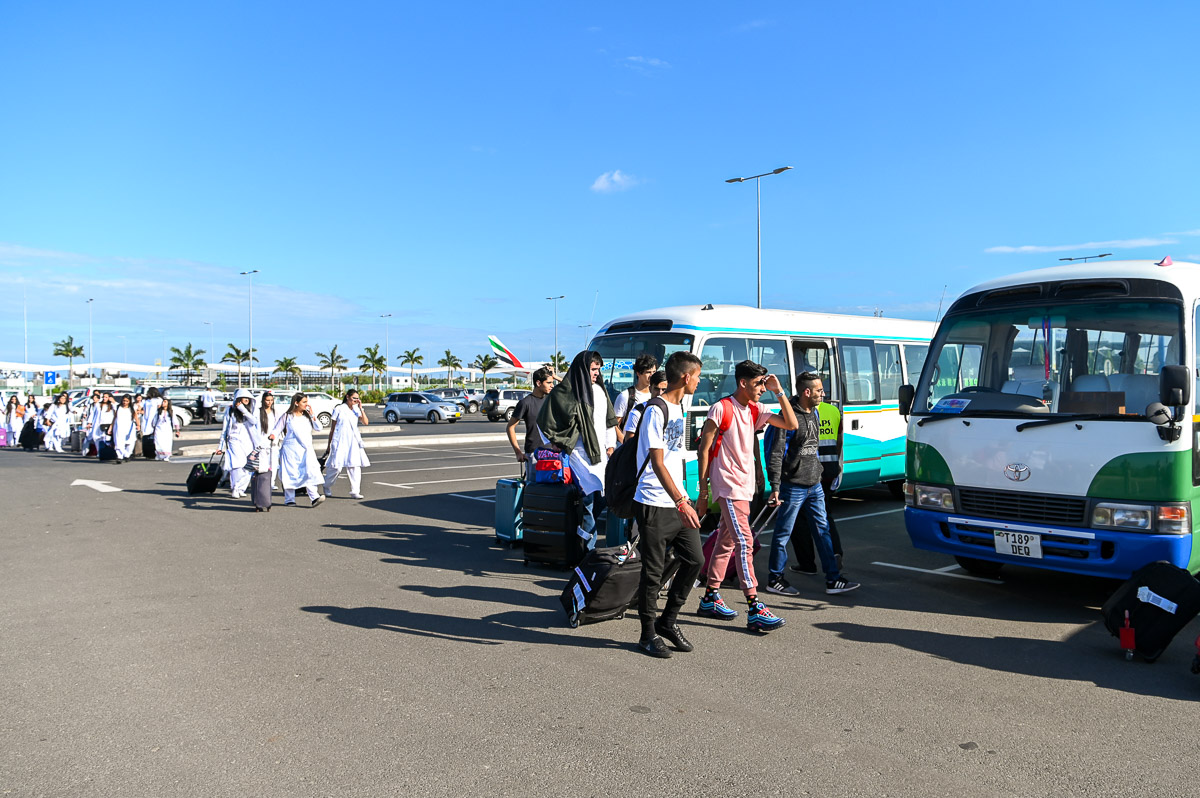 Youths arrive at the airport