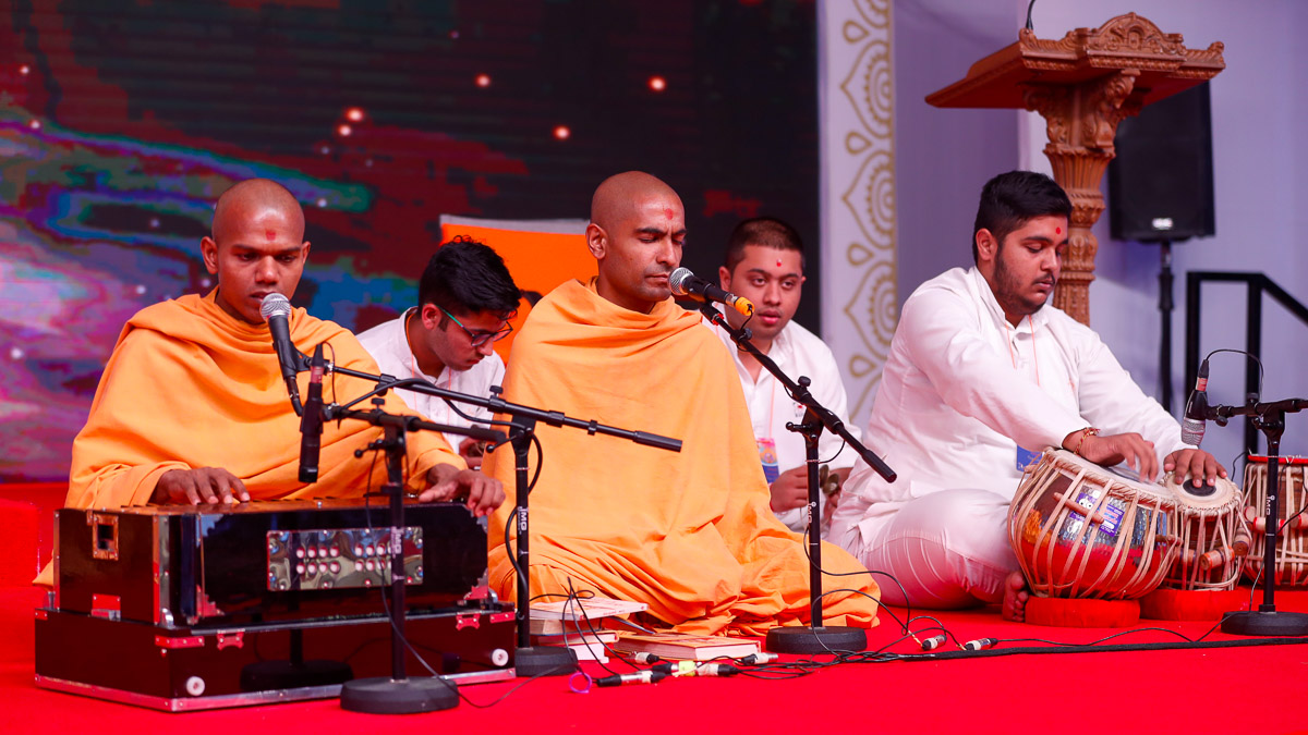 Sadhus sing kirtans in the opening session of the 'Divyam Kishore-Kishori Shibir'