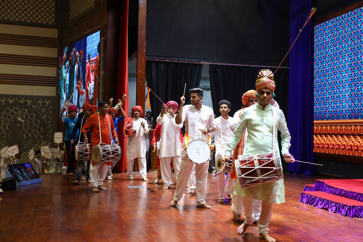 Children and youths present a parade to celebrate the Pramukh Smruti Din