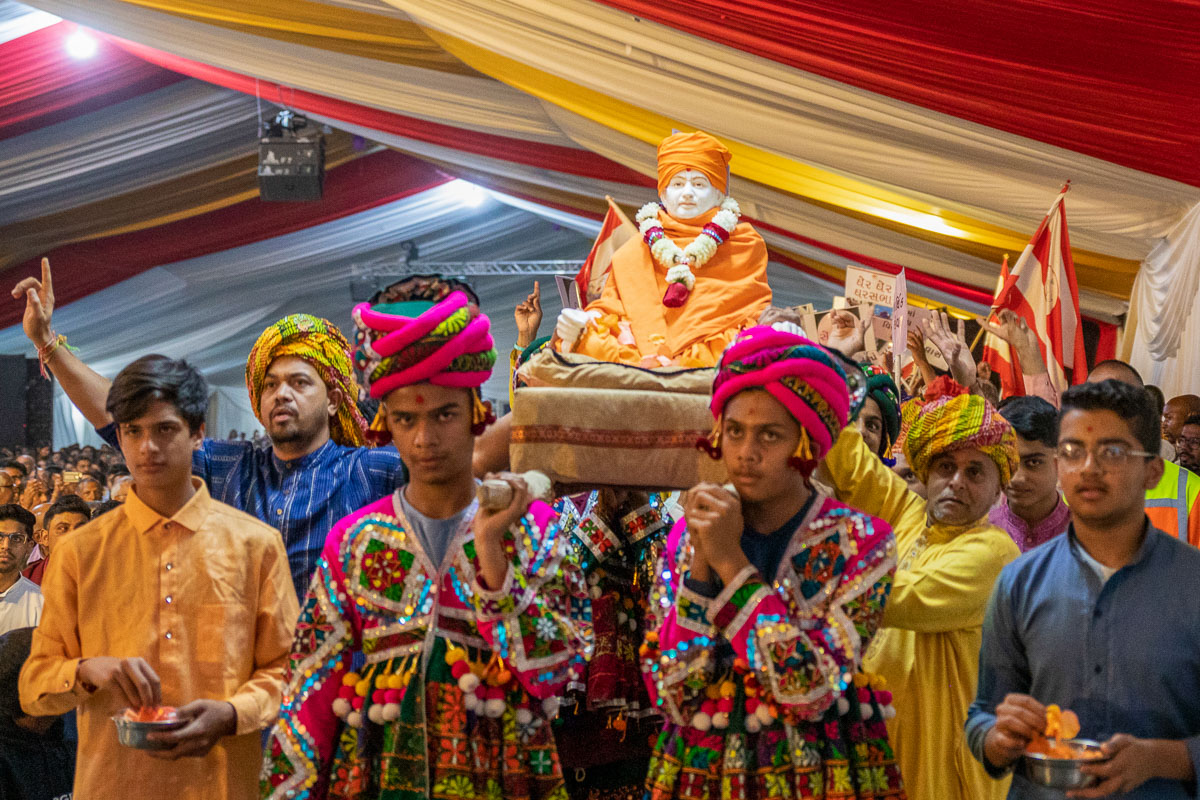 Youths and devotees participate in the parade