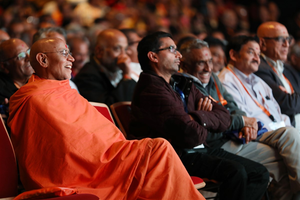 Swamis and delegates enjoy the presentation