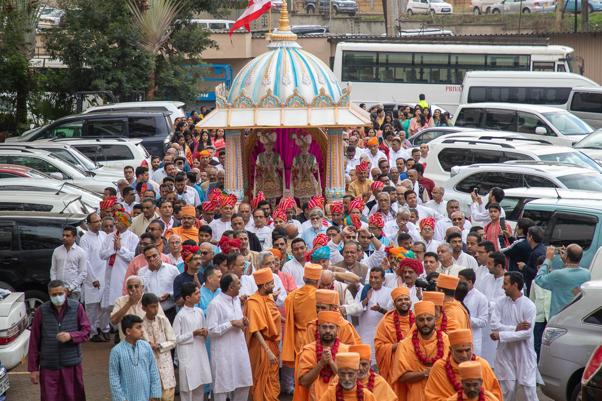 Sadhus and devotees perform pradakshina of the mandir