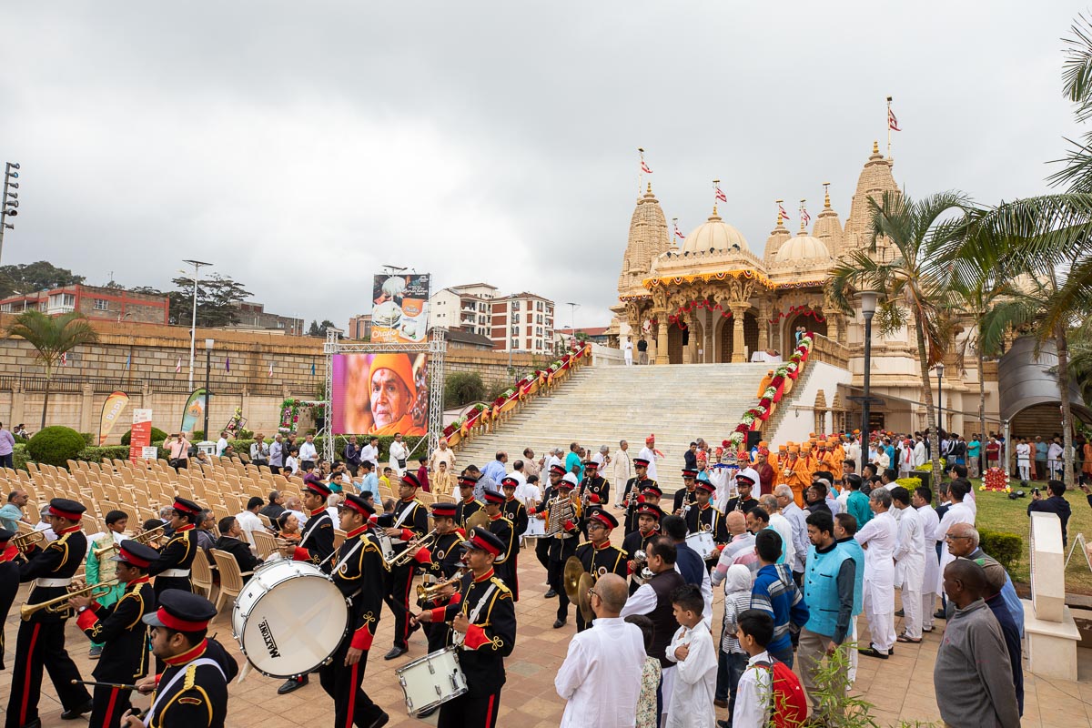 Sadhus and devotees perform pradakshina of the mandir