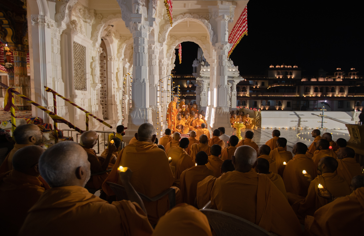 Sadhus perform the morning arti