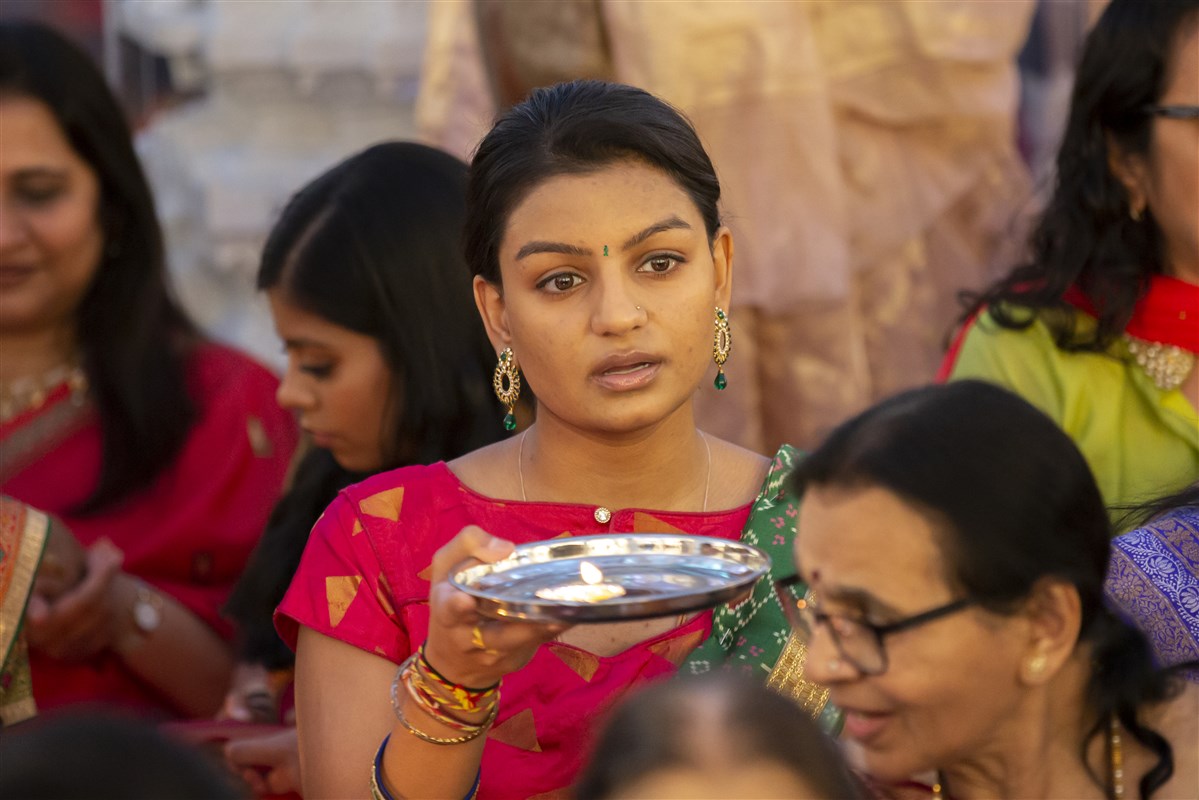 A devotee performs aarti
