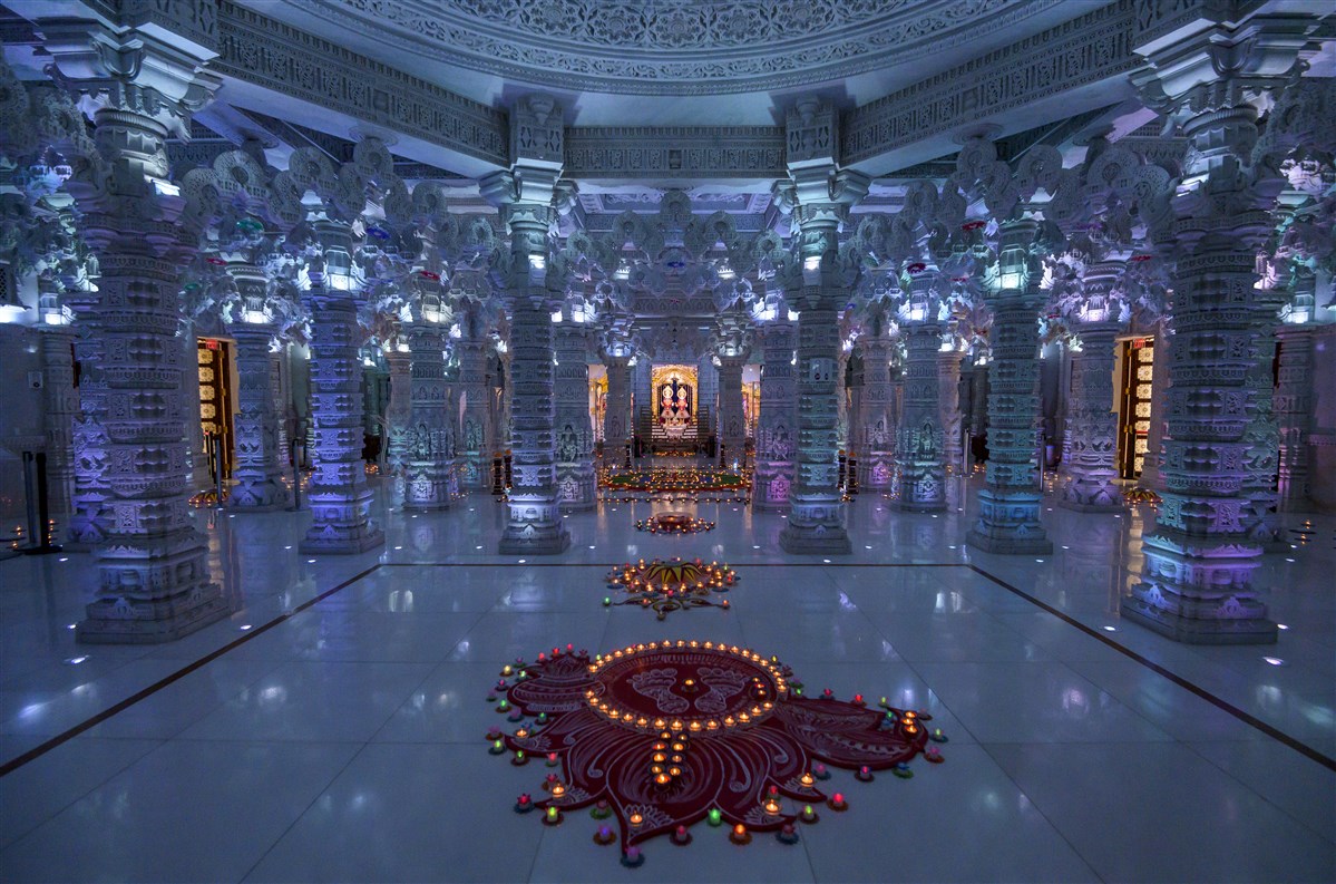 Multiple thematic decorations are displayed in the mandir