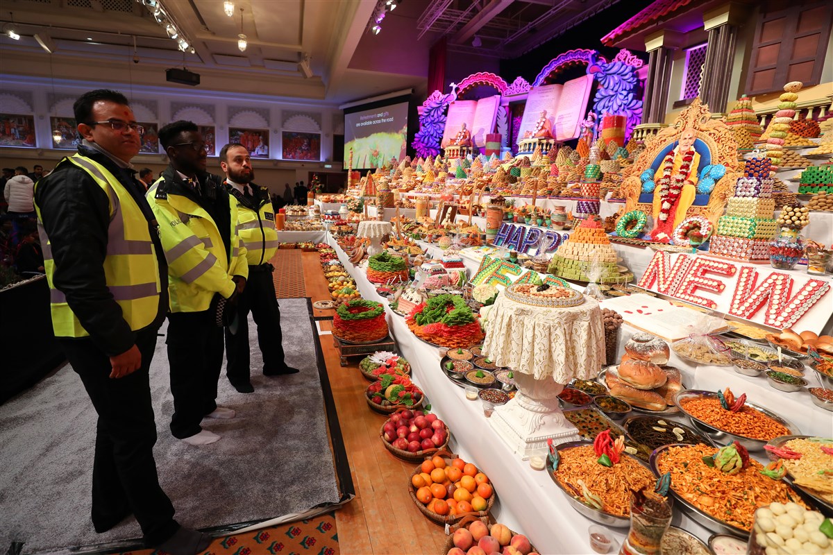 Members of the Metropolitan Police Service took time to observe and understand the annakut offering