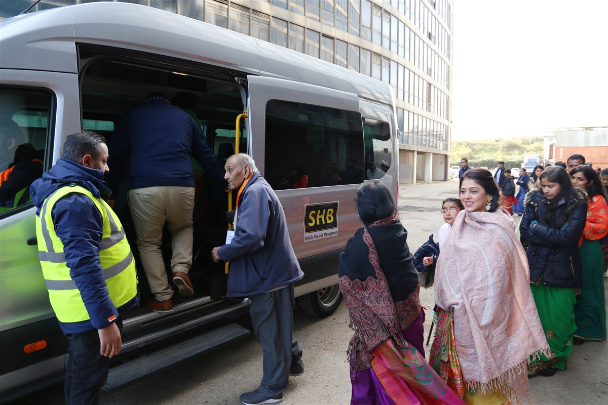 From the car parks, visitors were shuttled to and from the Mandir in minibuses throughout the day