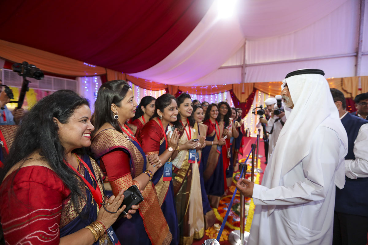 His Excellency Sheikh Nahayan Mabarak Al Nahayan greets volunteers of BAPS Hindu Mandir