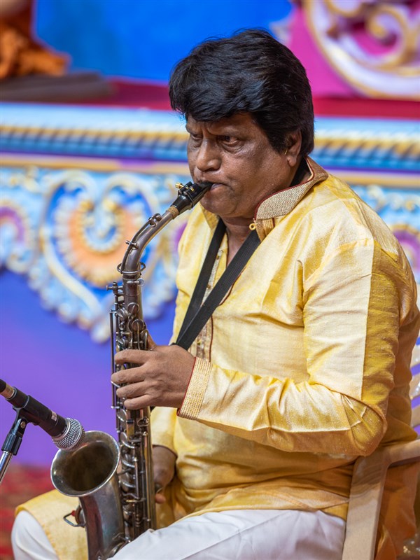 A musician plays the saxophone