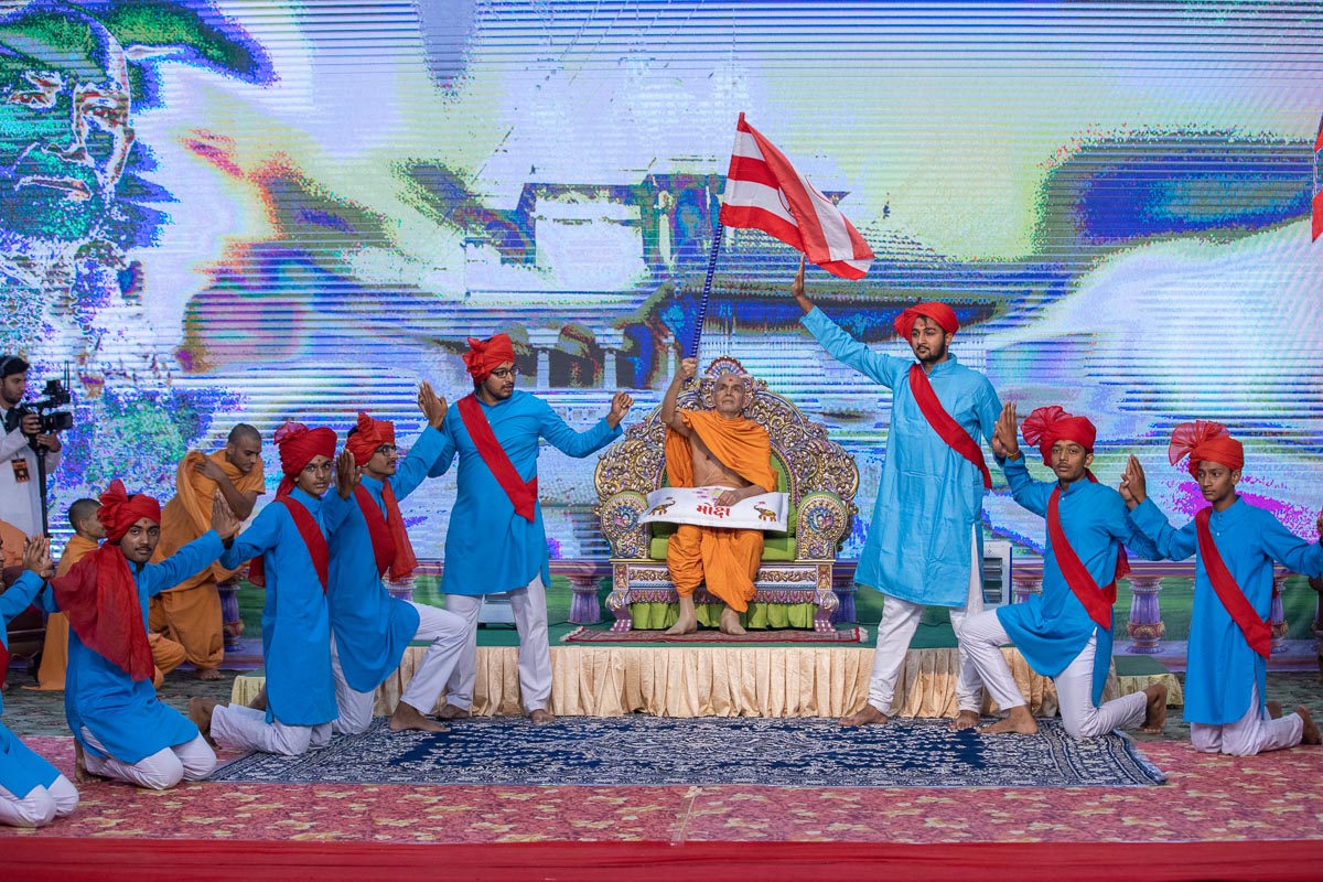 Swamishri waves a BAPS flag