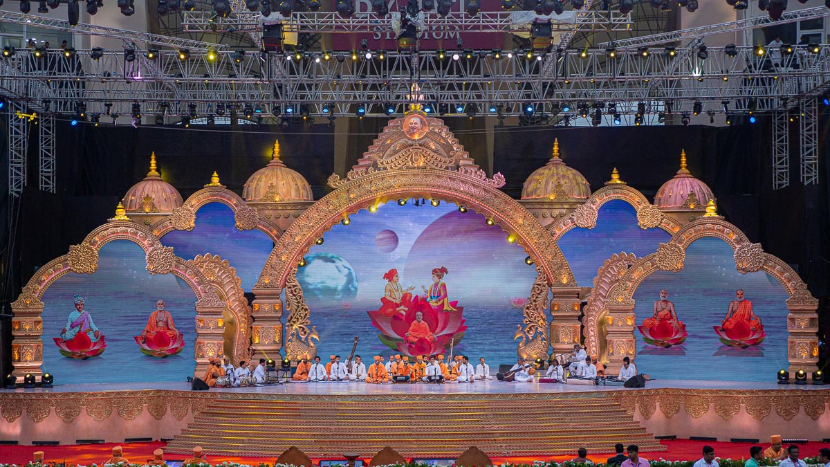 Sadhus and youths sing kirtans in the assembly