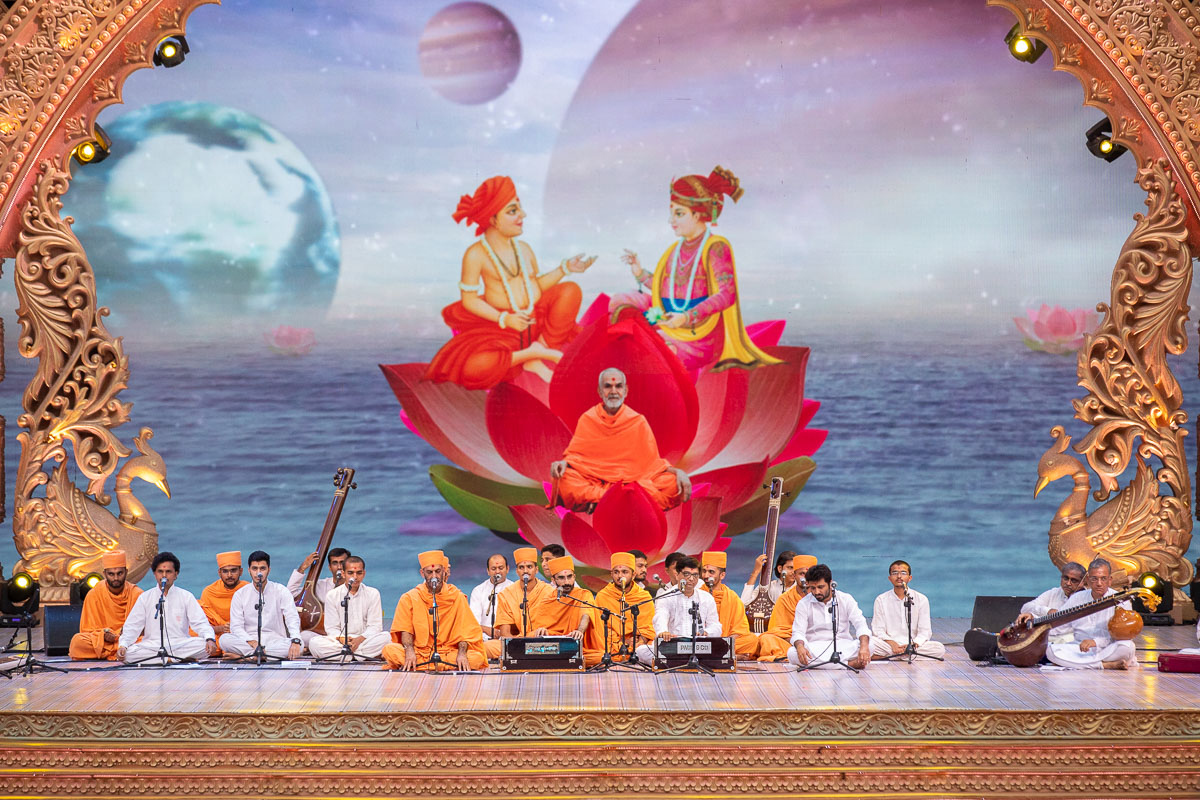 Sadhus and youths sing kirtans in the assembly