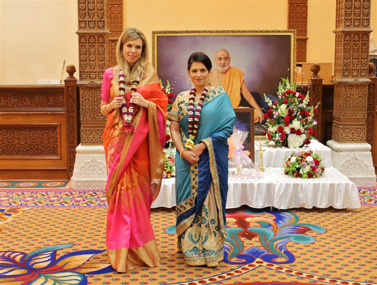 British Home Secretary Rt Hon. Priti Patel (R) and Carrie Symonds (L)