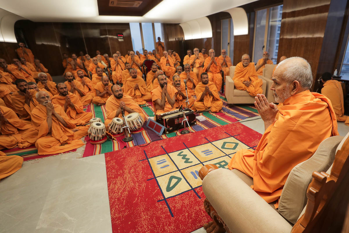 Swamishri greets sadhus with folded hands