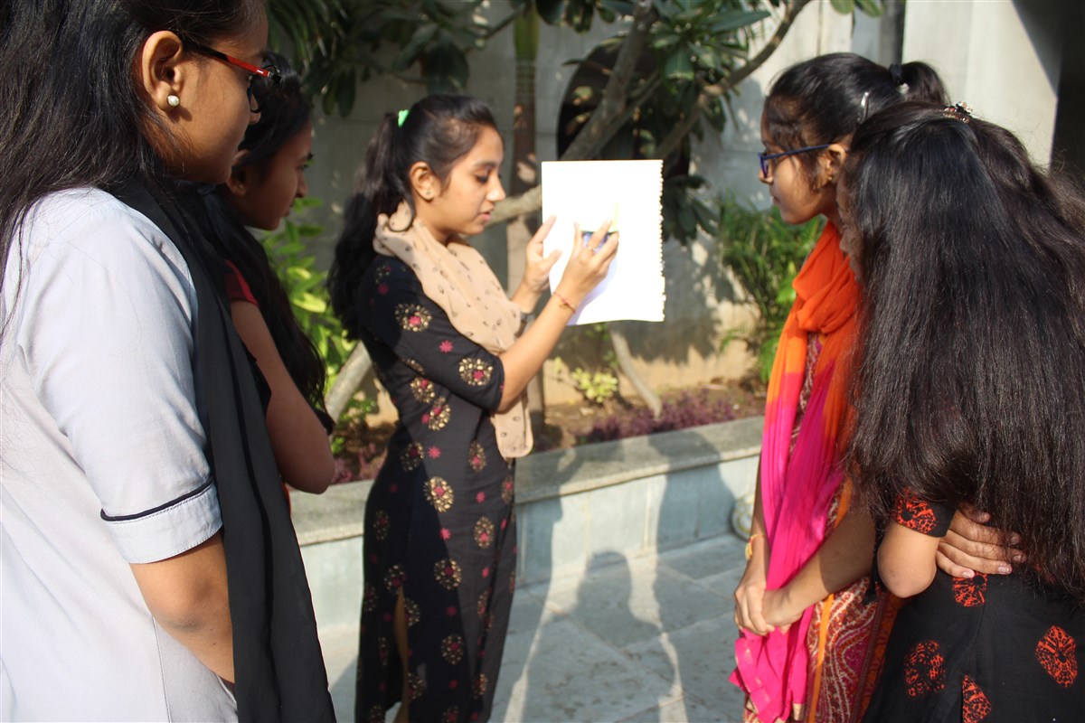 Students of 11th standard explained Eclipse with practical Examples to younger students 