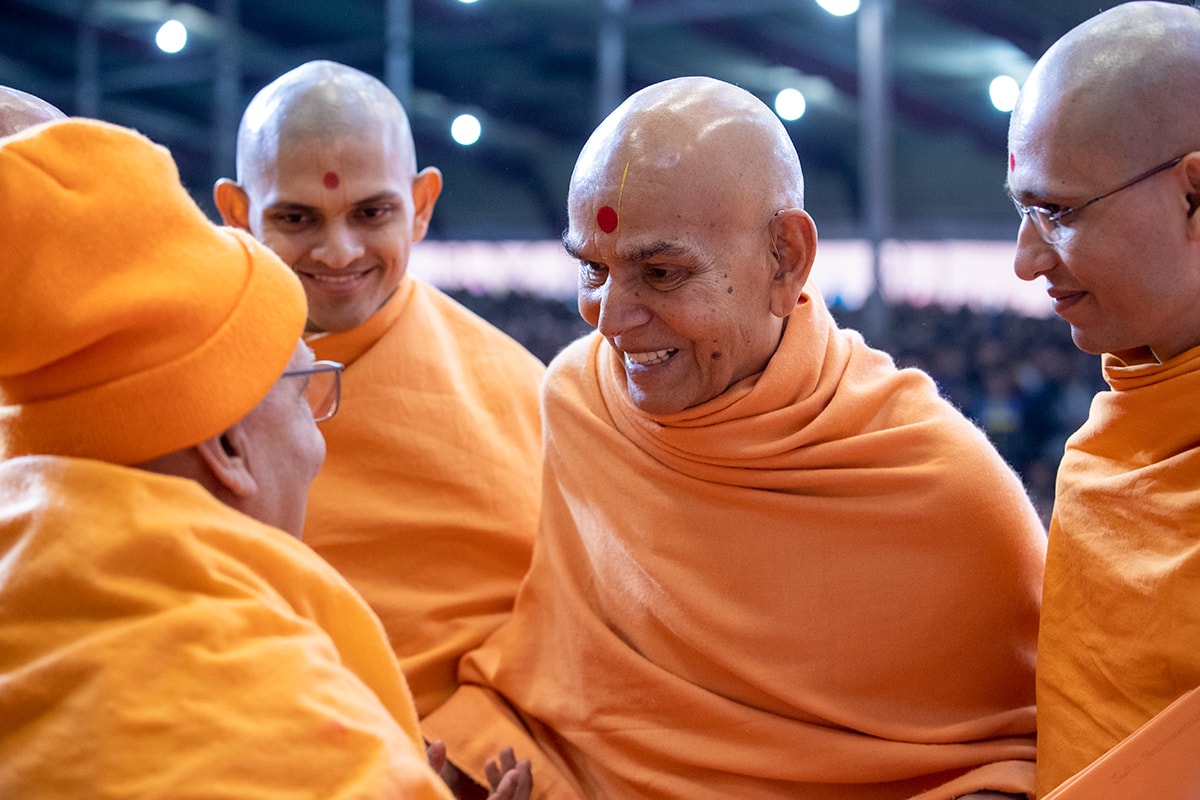 Swamishri shares a light moment with Pujya Ghanshyamcharan Swami
