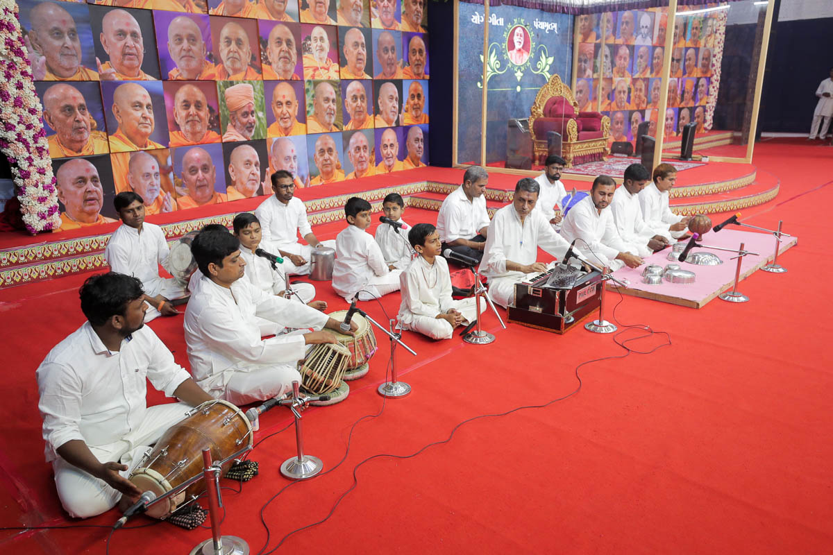Children and youths sing kirtans in the evening satsang assembly