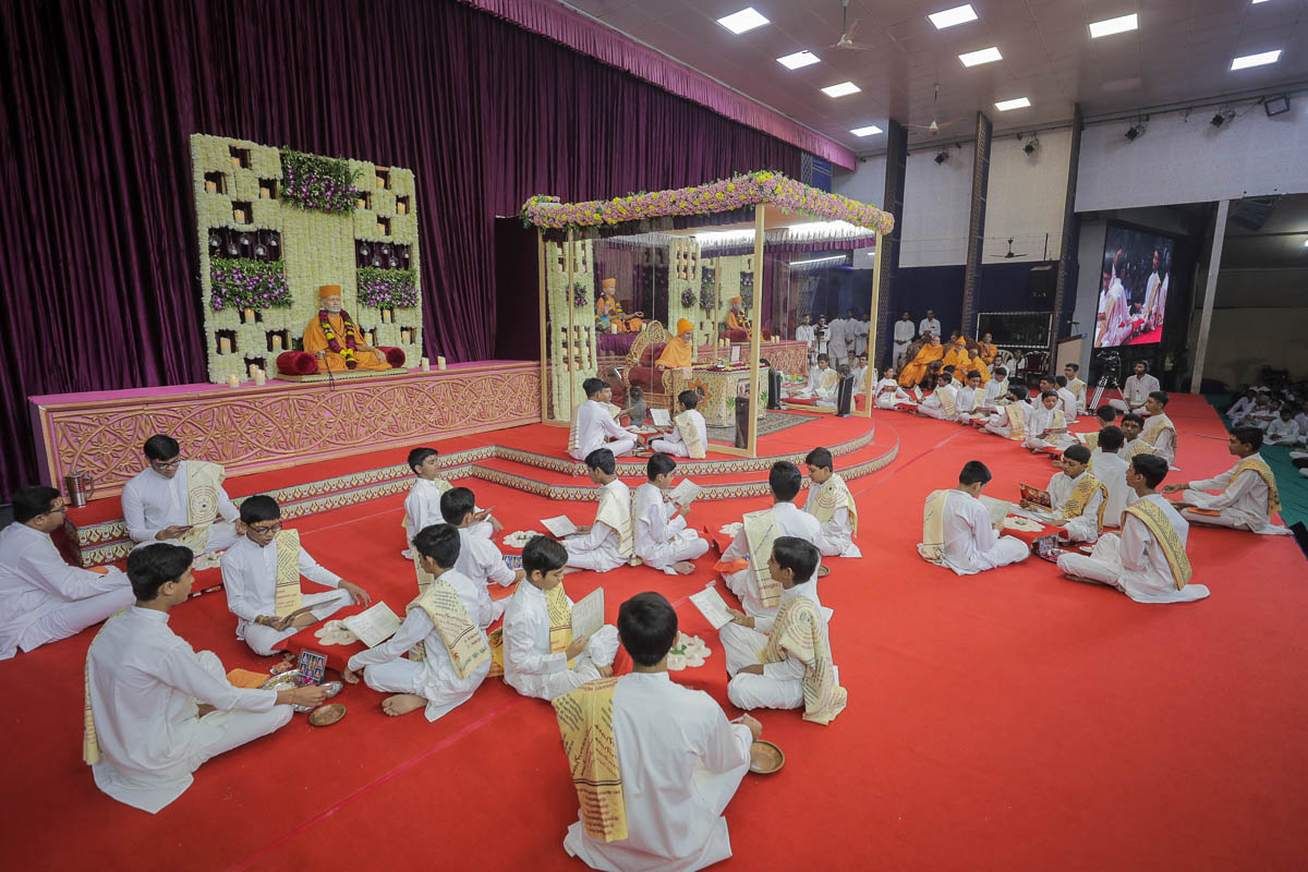 Children sing and perform the mahapuja