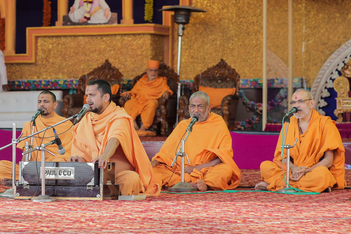 Sadhus sing kirtans during the murti-pratishtha assembly in the evening