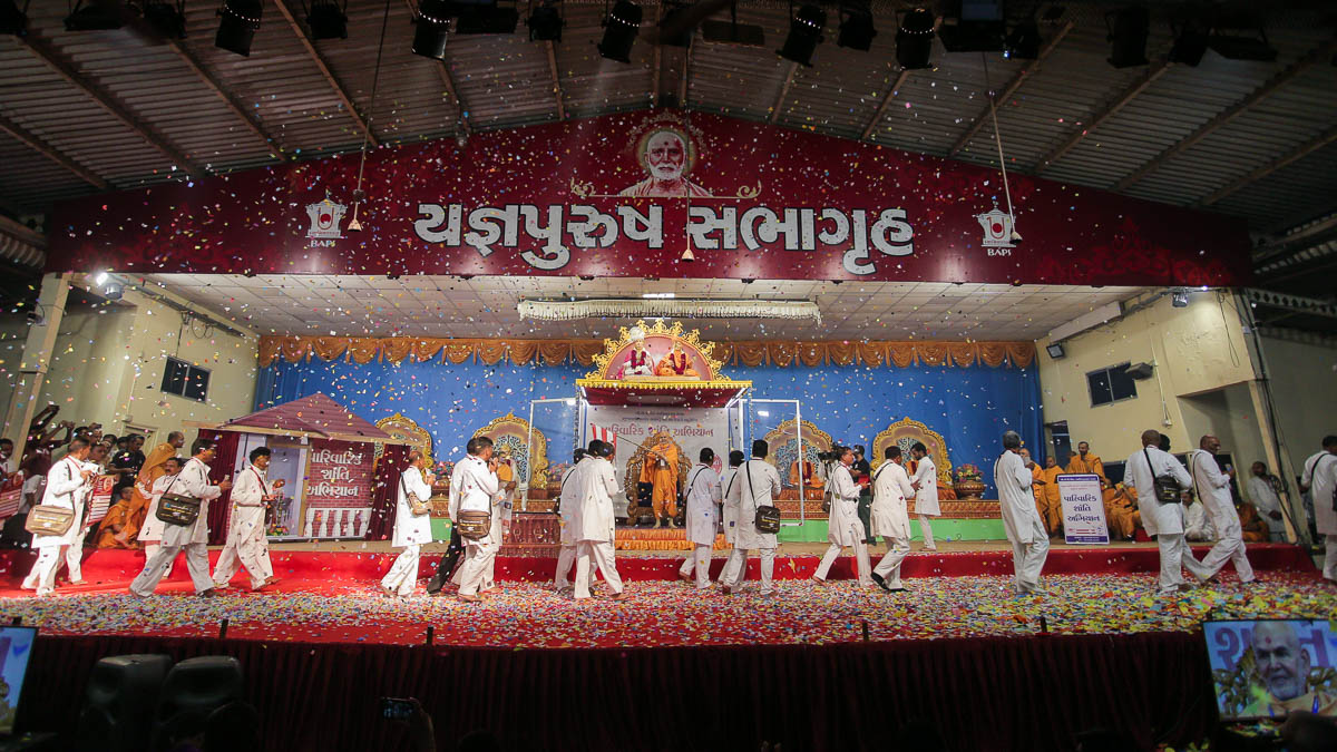 Karyakars perform a parade