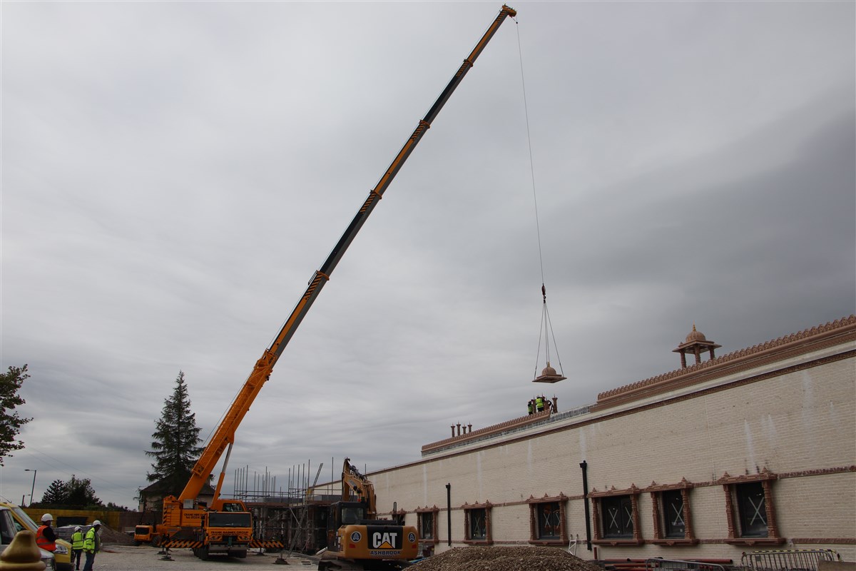 The crane is in place to help install the chhatris