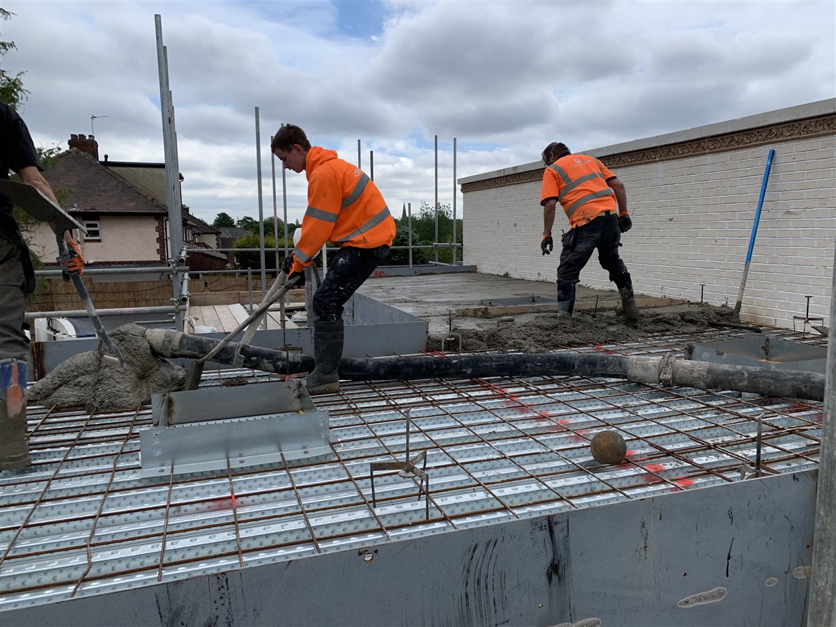 A concrete platform is laid upon the mandir's roof