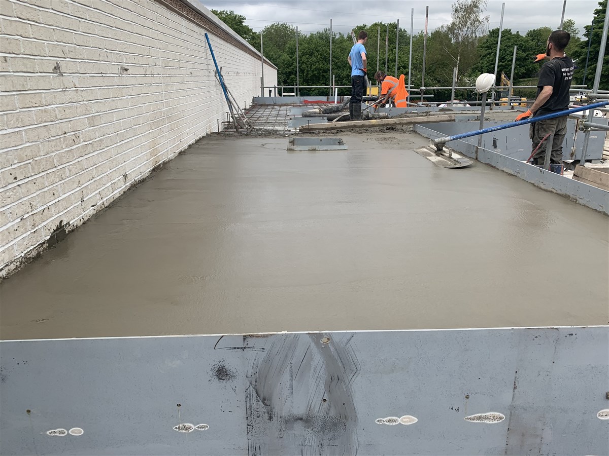 A concrete platform is laid upon the mandir's roof