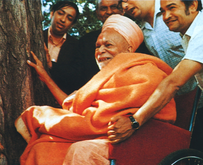 Yogiji Maharaj, after discoursing in a sabha under a tree, sanctifies the tree by graciously touching his head to it