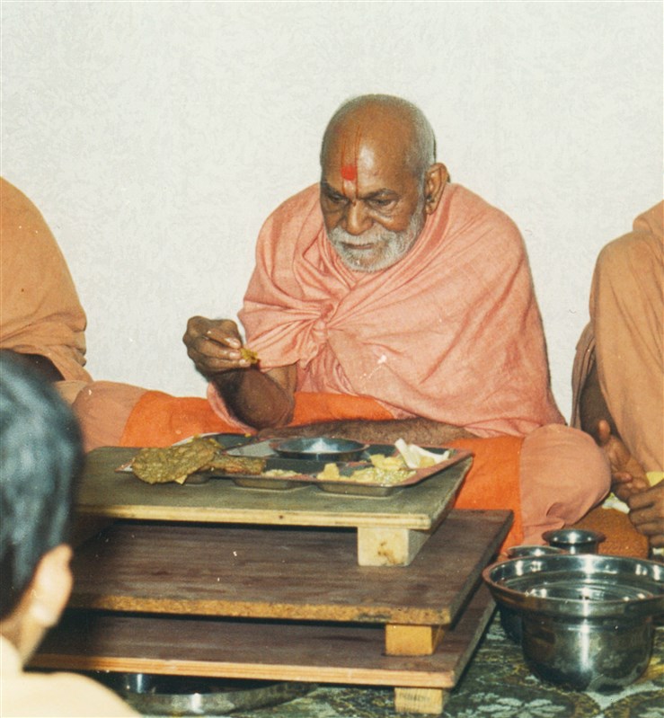 Yogiji Maharaj eating at 69 Ellesmere Road, Dollis Hill