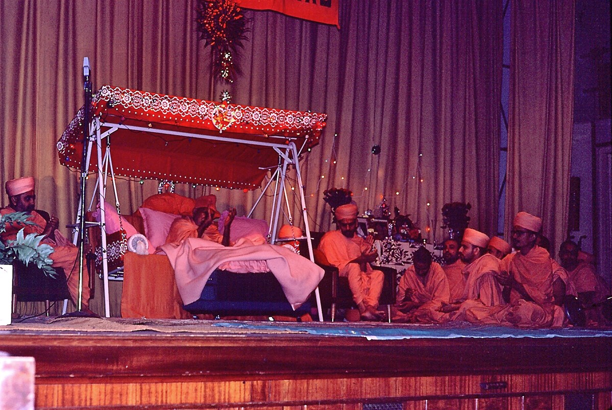 Yogiji Maharaj, Pramukh Swami, Mahant Swami, swamis and devotees joyously clap along to the melodious kirtans