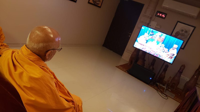 Sadguru Pujya Ghanshyamcharandas Swami watching the live webcast of the Calgary Shilanyas Vidhi