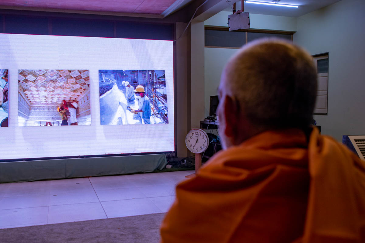 Swamishri watches the London Mandir 25th Anniversary finale celebration in the evening