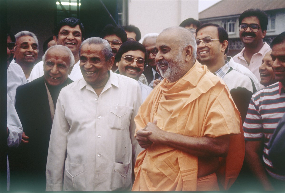CM Patel and Pramukh Swami Maharaj outside the old Meadow Garth hari mandir exchanging a jovial moment
