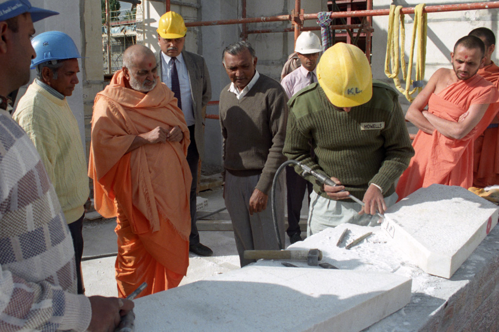 Pramukh Swami Maharaj visits the construction site ensuring that the work is being done on time and to the highest quality