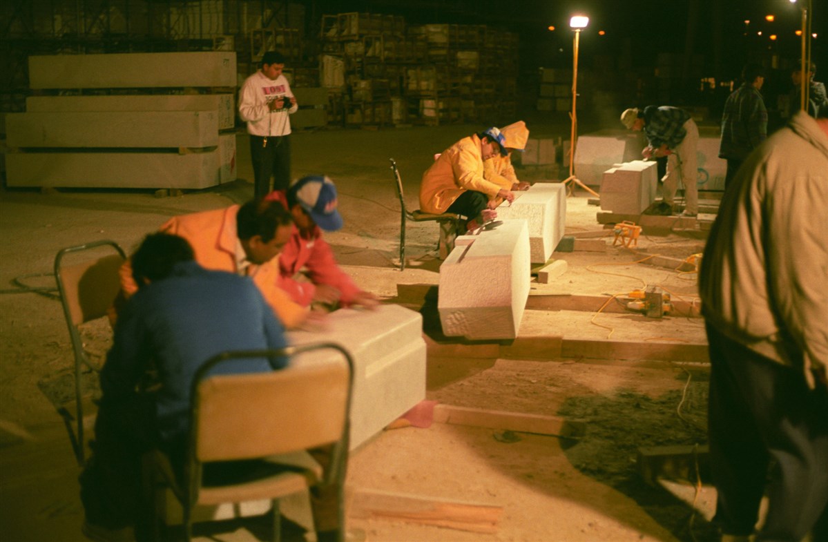 Volunteers on site work throughout the night to get the mandir completed on time