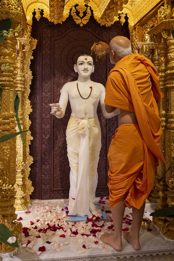 Swamis offer abhishek to the murtis