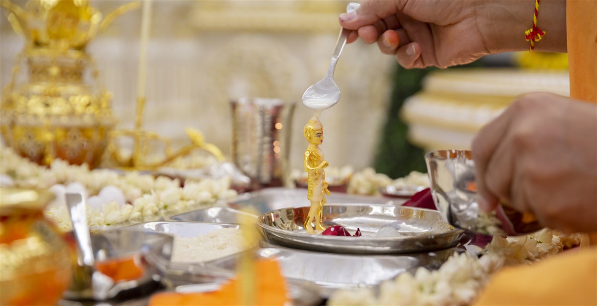 Swamis bathed the sacred images with panchamrut, a holy mixture of milk, yoghurt, ghee, honey and sugar crystals