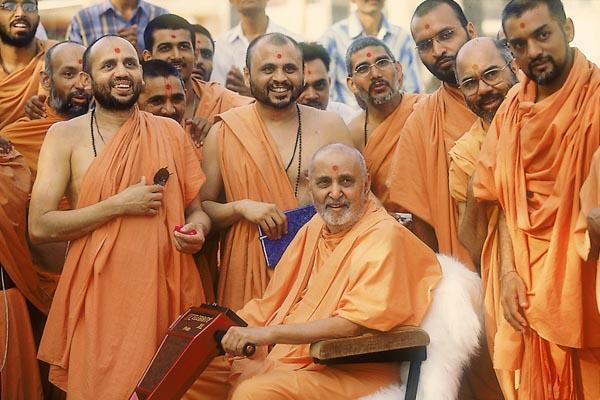  In a jovial mood with sadhus and devotees 